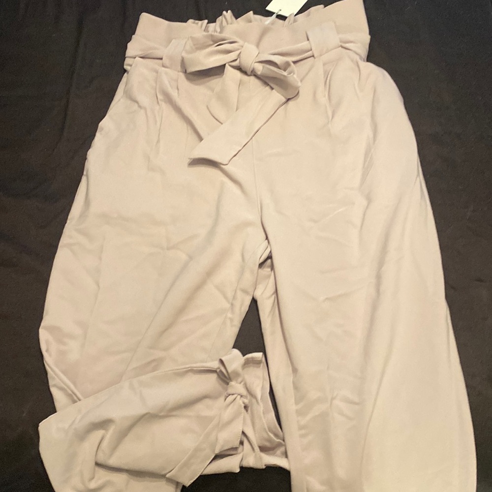 Stretchy high waist pants. Dusty beige. Size large. Fits 12